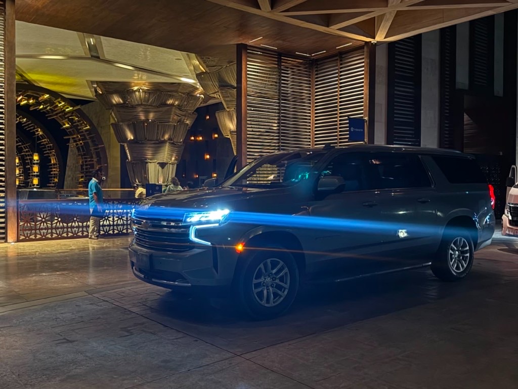 Chevrolet Suburban at a Los Cabos resort entrance at night