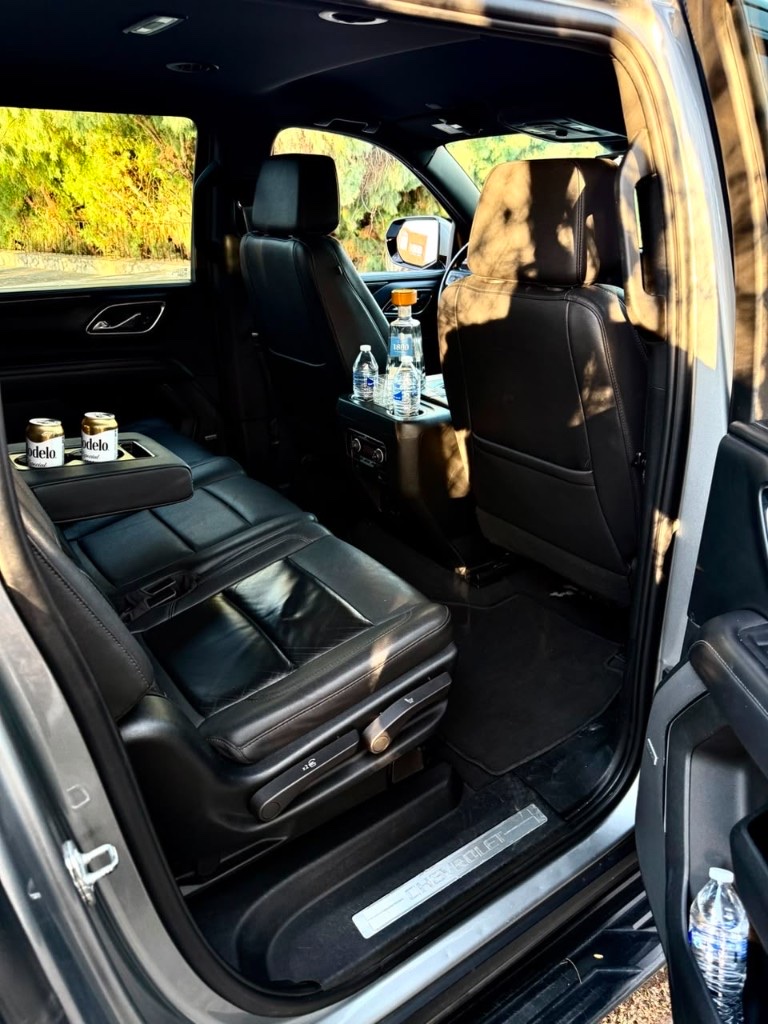 Black leather Suburban interior with rear climate control and refreshments